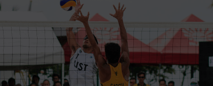 Two volleyball players playing against each other