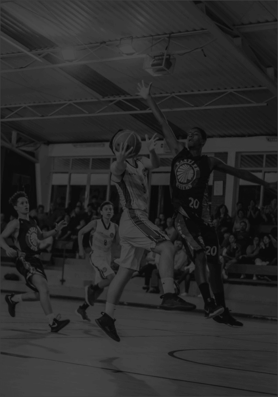 Two basketball teams playing against each other