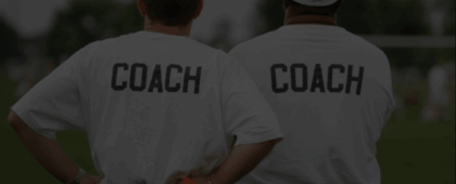 Two coaches scouting for talent