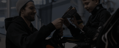 A child being offered a signing by a coach